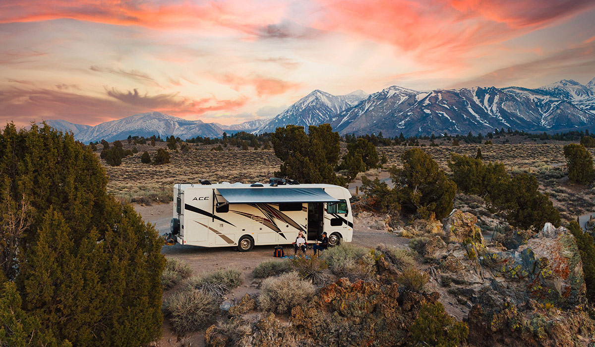 A spacious Class A motorhome parked in a scenic German location