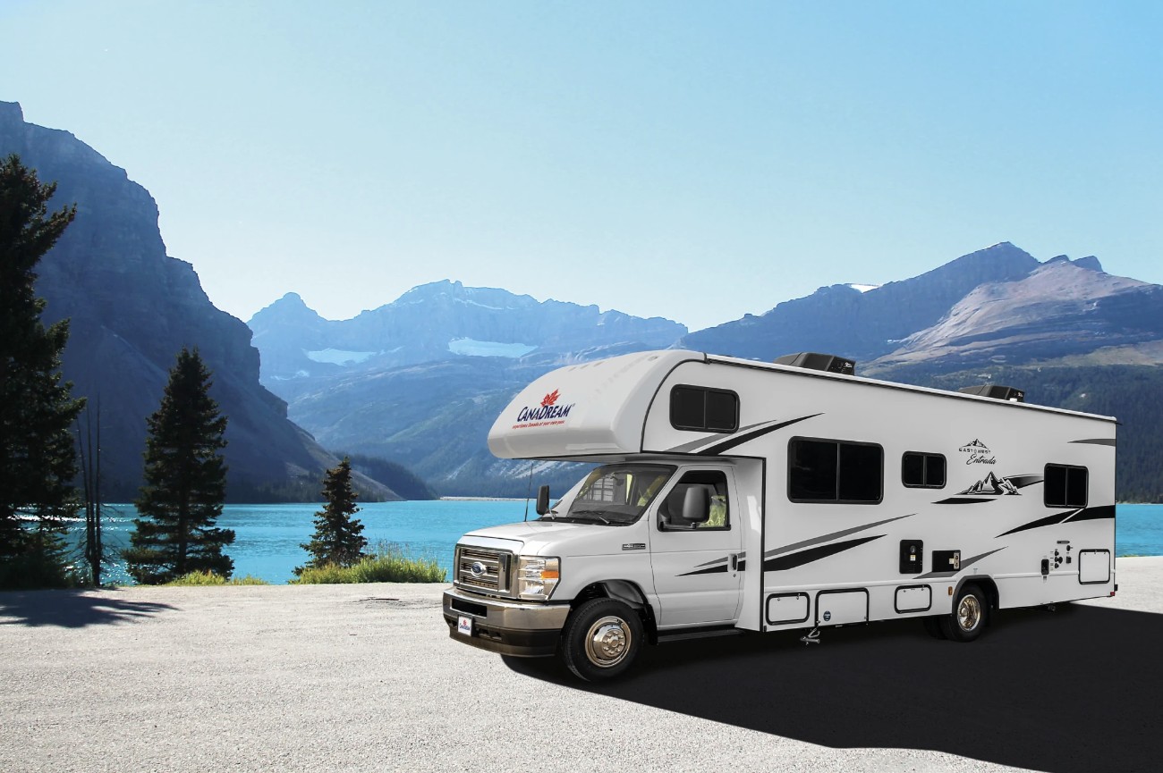 A Class C motorhome ready for rental in a scenic German landscape