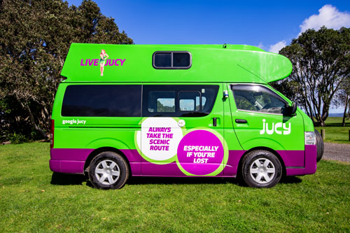 Jucy Campervan - Exterior Side View - Green and Purple