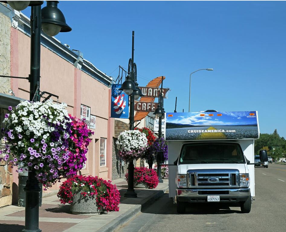 Cruise America Class C Motorhome parked on a town street