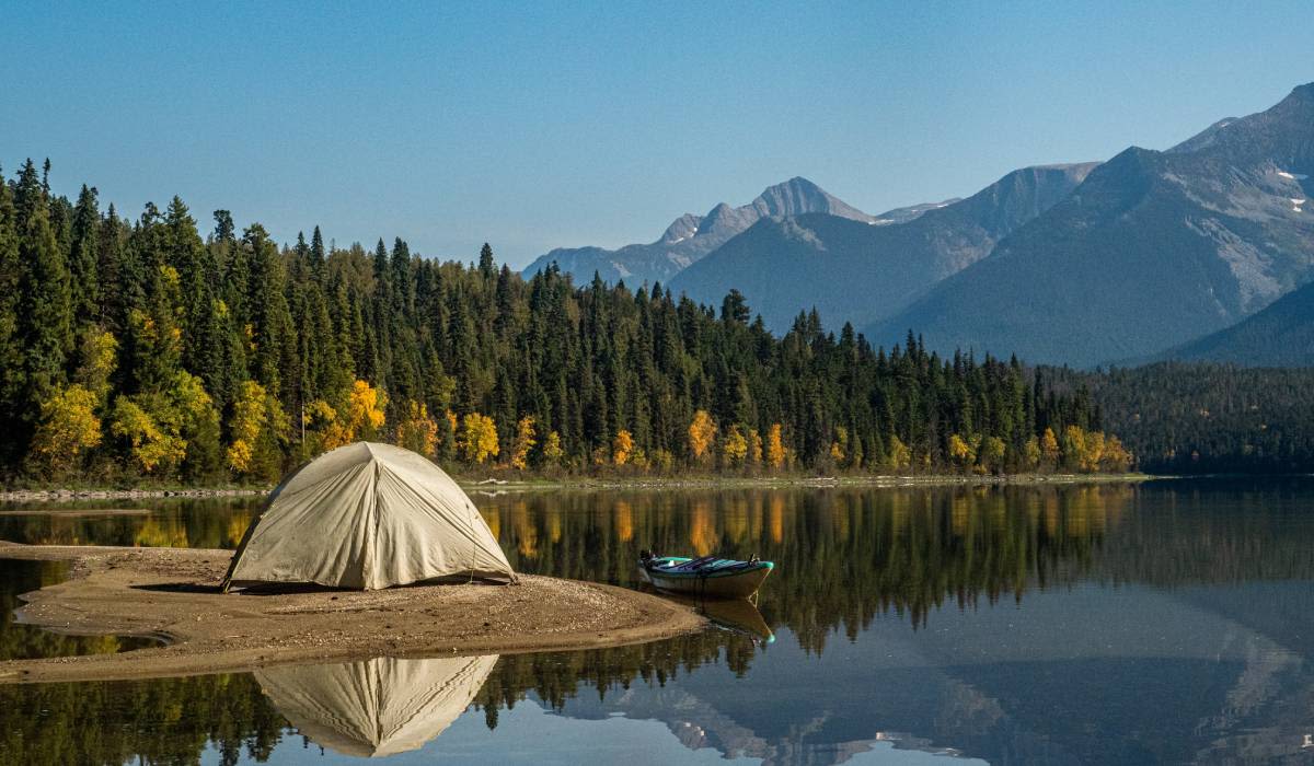 A serene campsite at Chatfield State Park near Denver with an RV and calm lake waters