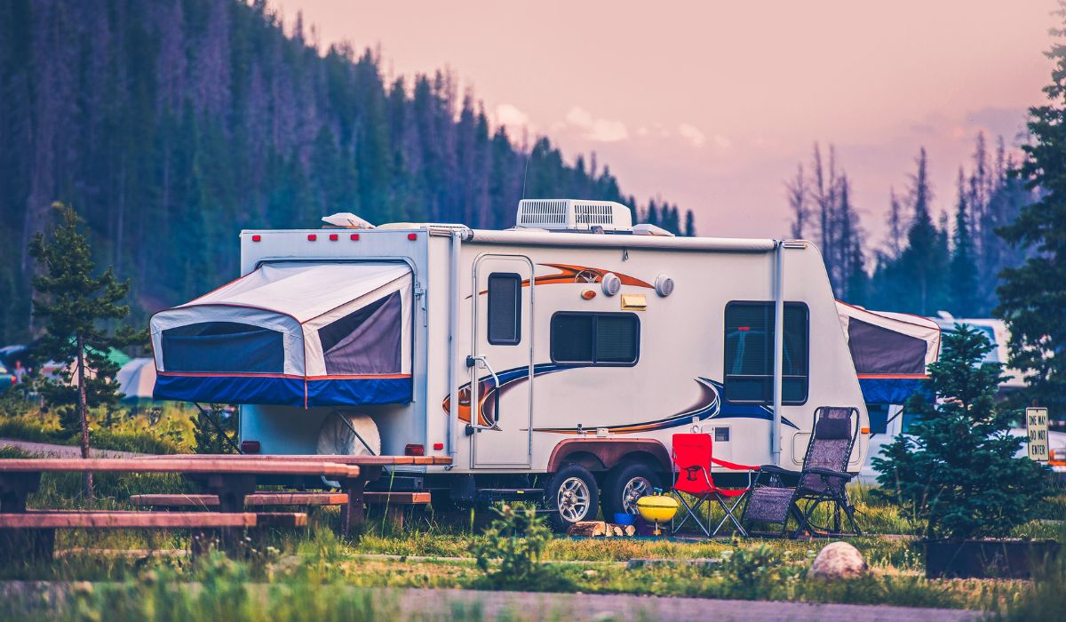 A Class C motorhome parked at a scenic campground near Denver