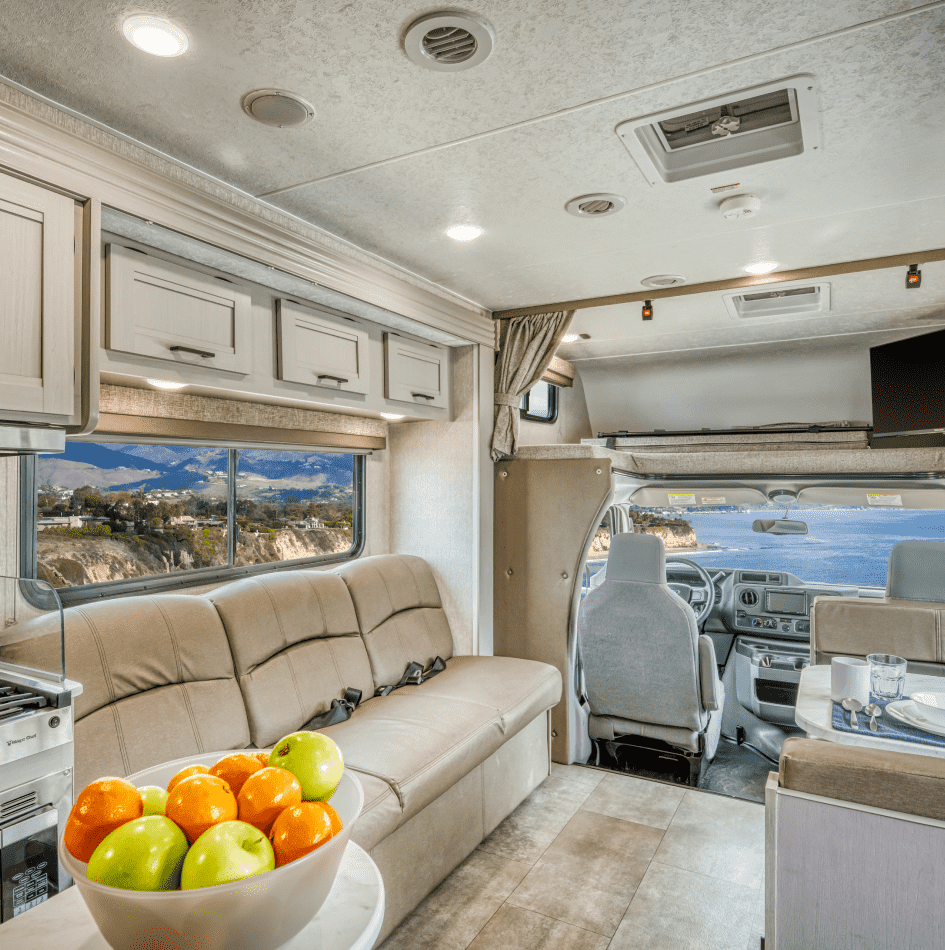 The interior living space of a Class C motorhome available for rent in Denver