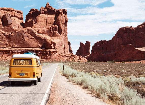 Family enjoying the view from their rented RV on a Los Angeles road trip