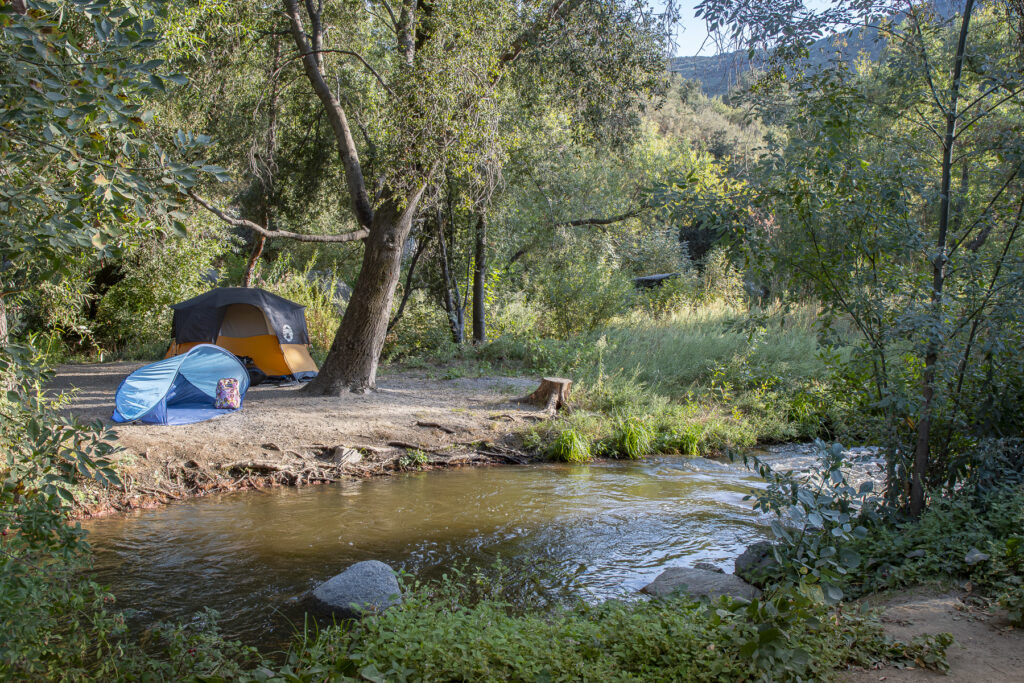 A serene view of an RV campground nestled in the natural landscape of San Diego County.