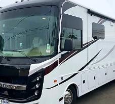 Interior of a modern Class A motorhome kitchen and living area