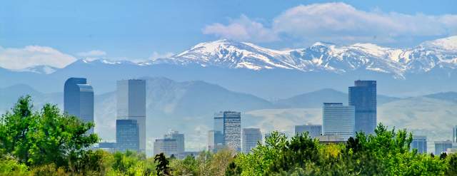 Denver skyline with snow-capped mountains in the background