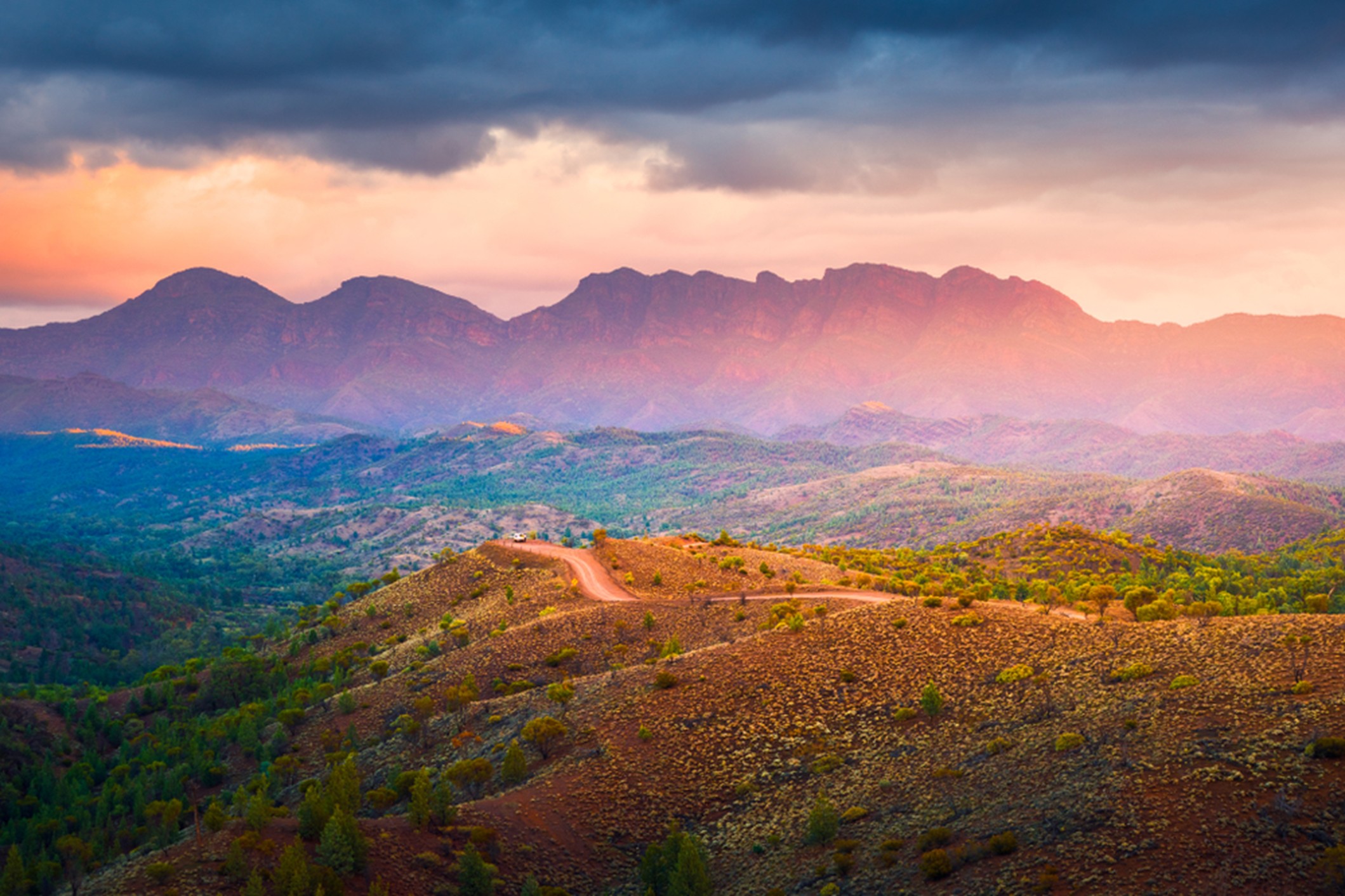 A rented RV driving through the scenic Flinders Ranges near Adelaide.
