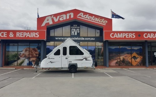 A variety of motorhomes parked with an Adelaide backdrop