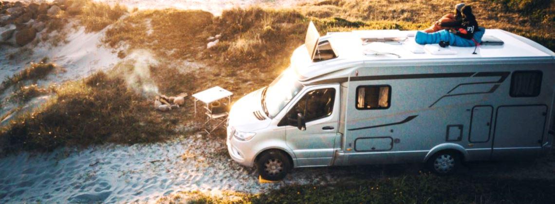 A campervan parked in a picturesque Dutch village, ready for a long-term RV rental adventure from Amsterdam.