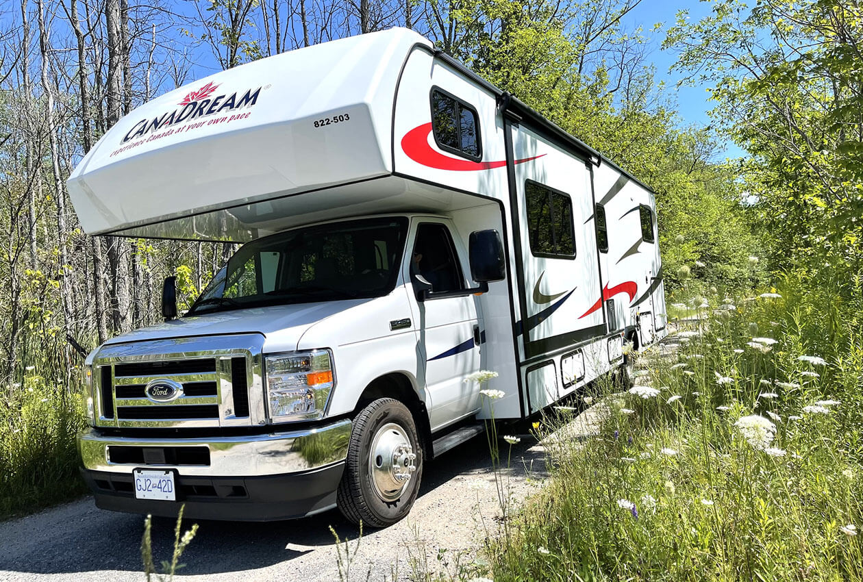 A Class C motorhome rental parked at an Ontario Provincial Park campground near Toronto