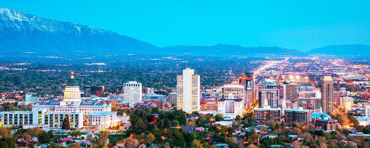 Scenic view of the Salt Lake City skyline with mountains in the background.