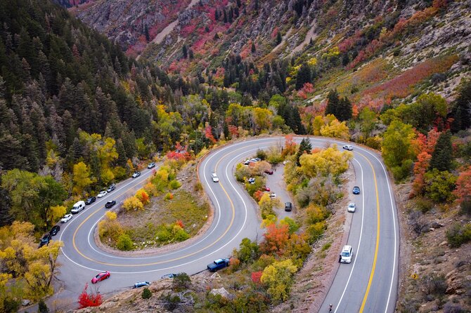 A couple enjoys a scenic drive in their rented campervan near Salt Lake City