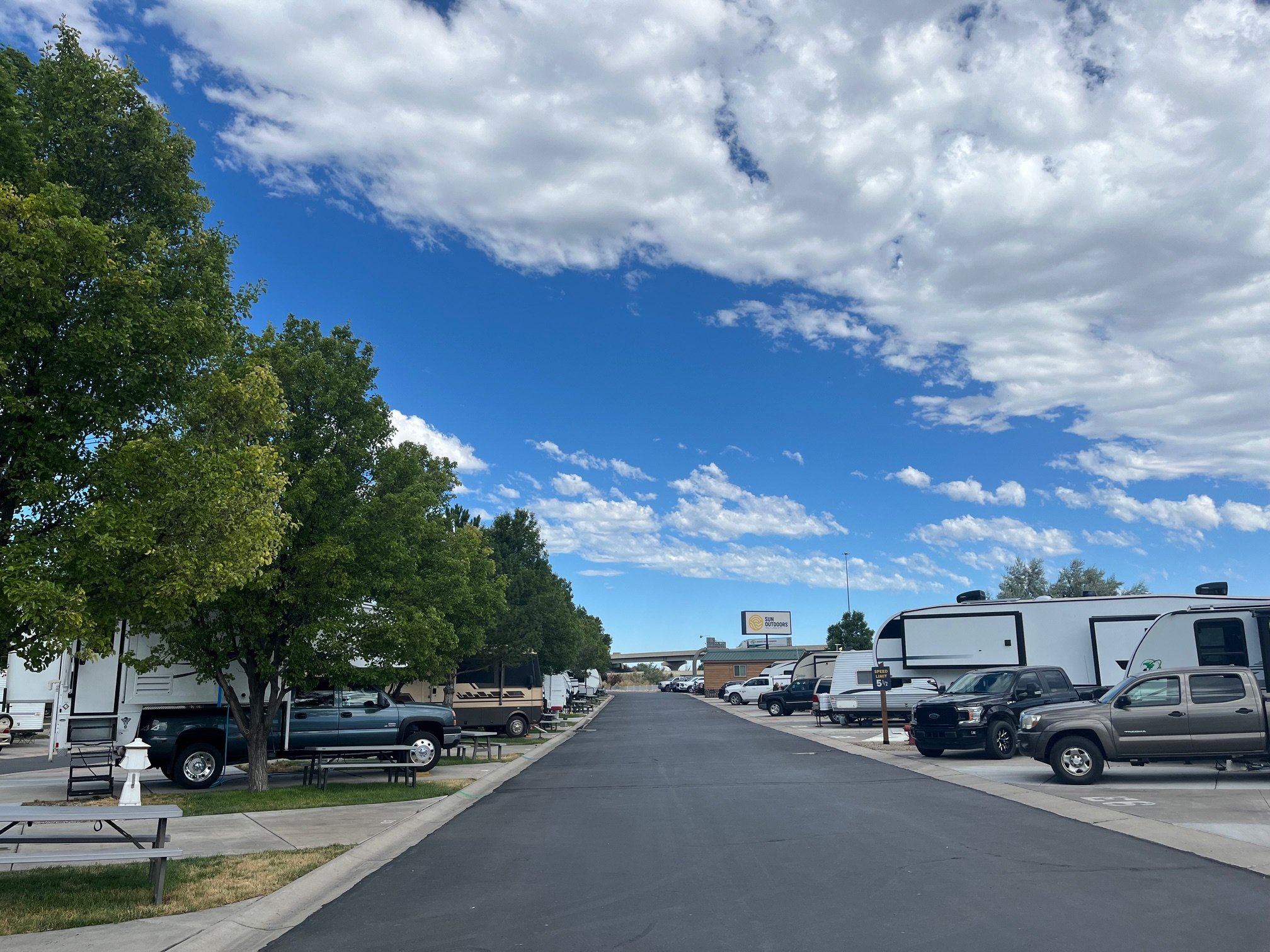 A row of different RVs at a campground in Salt Lake City