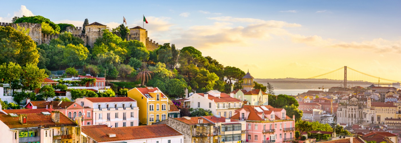 Scenic view over the historic rooftops of Lisbon towards the sea
