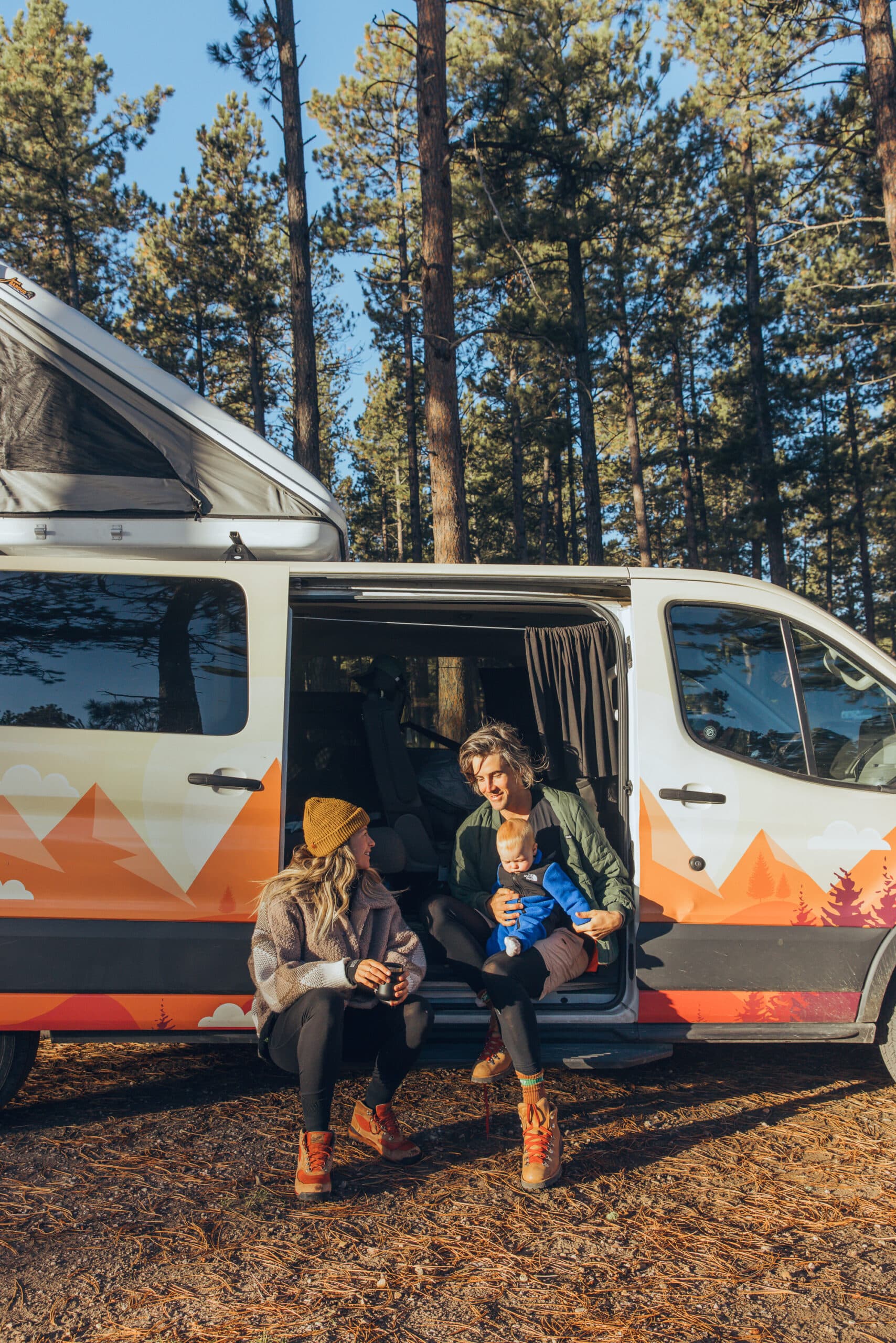 Couple enjoying the view from their rented campervan near Seattle
